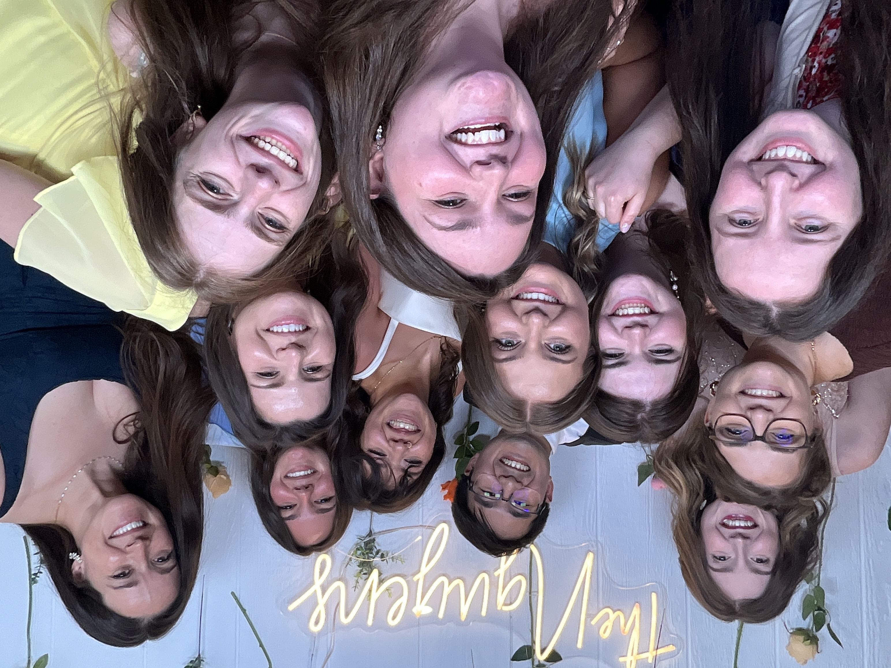 Smiling guests with photo booth prints at an Ohio celebration